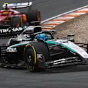 ZANDVOORT, NETHERLANDS - AUGUST 31: George Russell of Great Britain driving the (63) Mercedes AMG Petronas F1 Team W16 leads Lewis Hamilton of Great Britain driving the (44) Scuderia Ferrari SF-25 on track during the F1 Grand Prix of Netherlands at Circuit Zandvoort on August 31, 2025 in Zandvoort, Netherlands. (Photo by Joe Portlock/Getty Images)