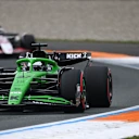 ZANDVOORT, NETHERLANDS - AUGUST 31: Nico Hulkenberg of Germany driving the (27) Kick Sauber C45 Ferrari leads Esteban Ocon of France driving the (31) Haas F1 VF-25 Ferrari on track during the F1 Grand Prix of Netherlands at Circuit Zandvoort on August 31, 2025 in Zandvoort, Netherlands. (Photo by James Sutton/Getty Images)