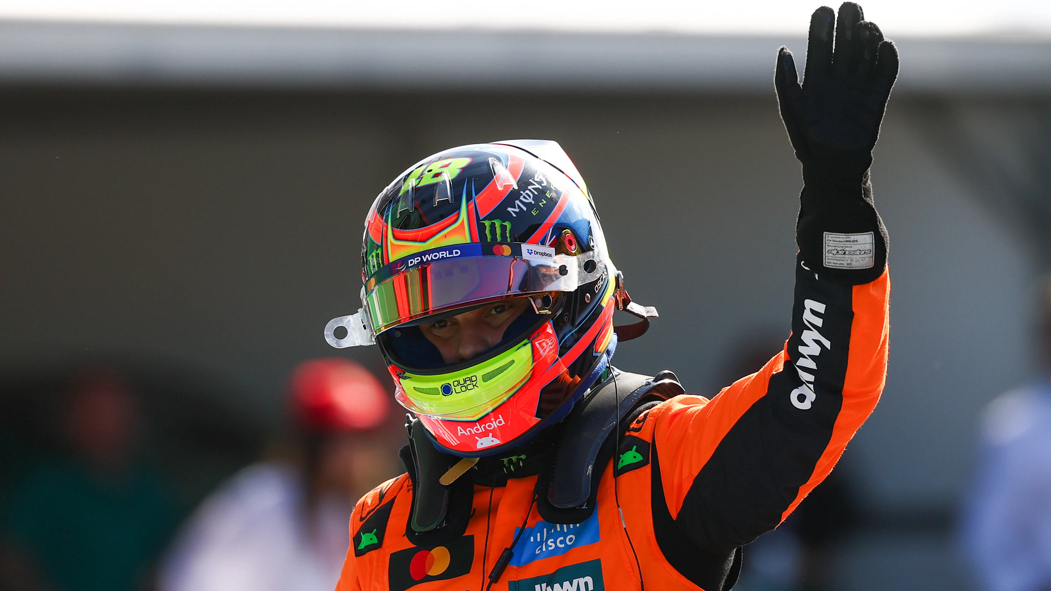 ZANDVOORT, NETHERLANDS - AUGUST 30: Pole position qualifier Oscar Piastri of Australia and McLaren waves in parc ferme during qualifying ahead of the F1 Grand Prix of Netherlands at Circuit Zandvoort on August 30, 2025 in Zandvoort, Netherlands. (Photo by Mark Thompson/Getty Images)
