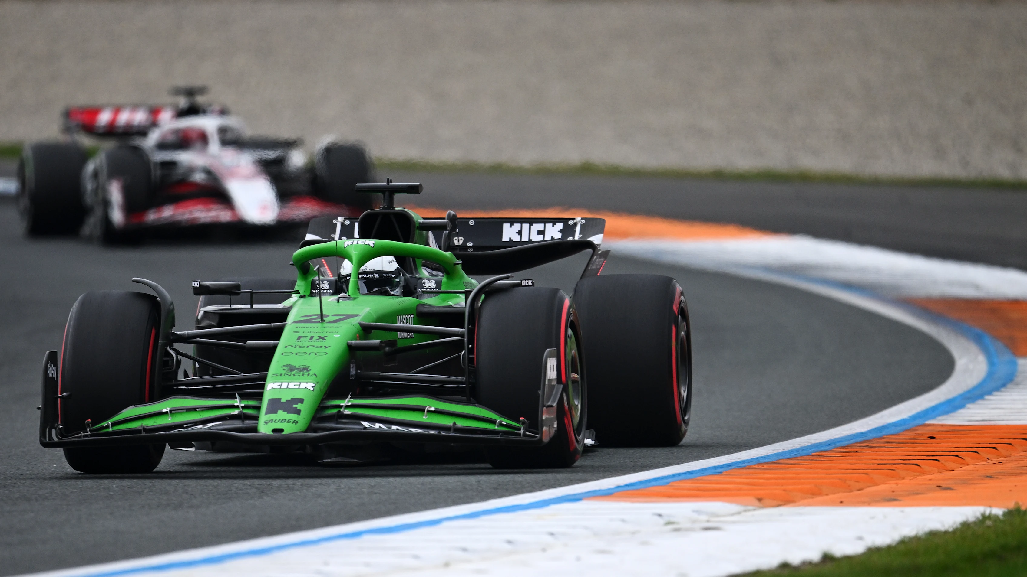 ZANDVOORT, NETHERLANDS - AUGUST 31: Nico Hulkenberg of Germany driving the (27) Kick Sauber C45 Ferrari leads Esteban Ocon of France driving the (31) Haas F1 VF-25 Ferrari on track during the F1 Grand Prix of Netherlands at Circuit Zandvoort on August 31, 2025 in Zandvoort, Netherlands. (Photo by James Sutton/Getty Images)