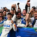 ZANDVOORT, NETHERLANDS - AUGUST 31: Third placed Isack Hadjar of France and Visa Cash App Racing Bulls celebrates with his team in parc ferme during the F1 Grand Prix of Netherlands at Circuit Zandvoort on August 31, 2025 in Zandvoort, Netherlands. (Photo by Mark Sutton - Formula 1/Formula 1 via Getty Images)