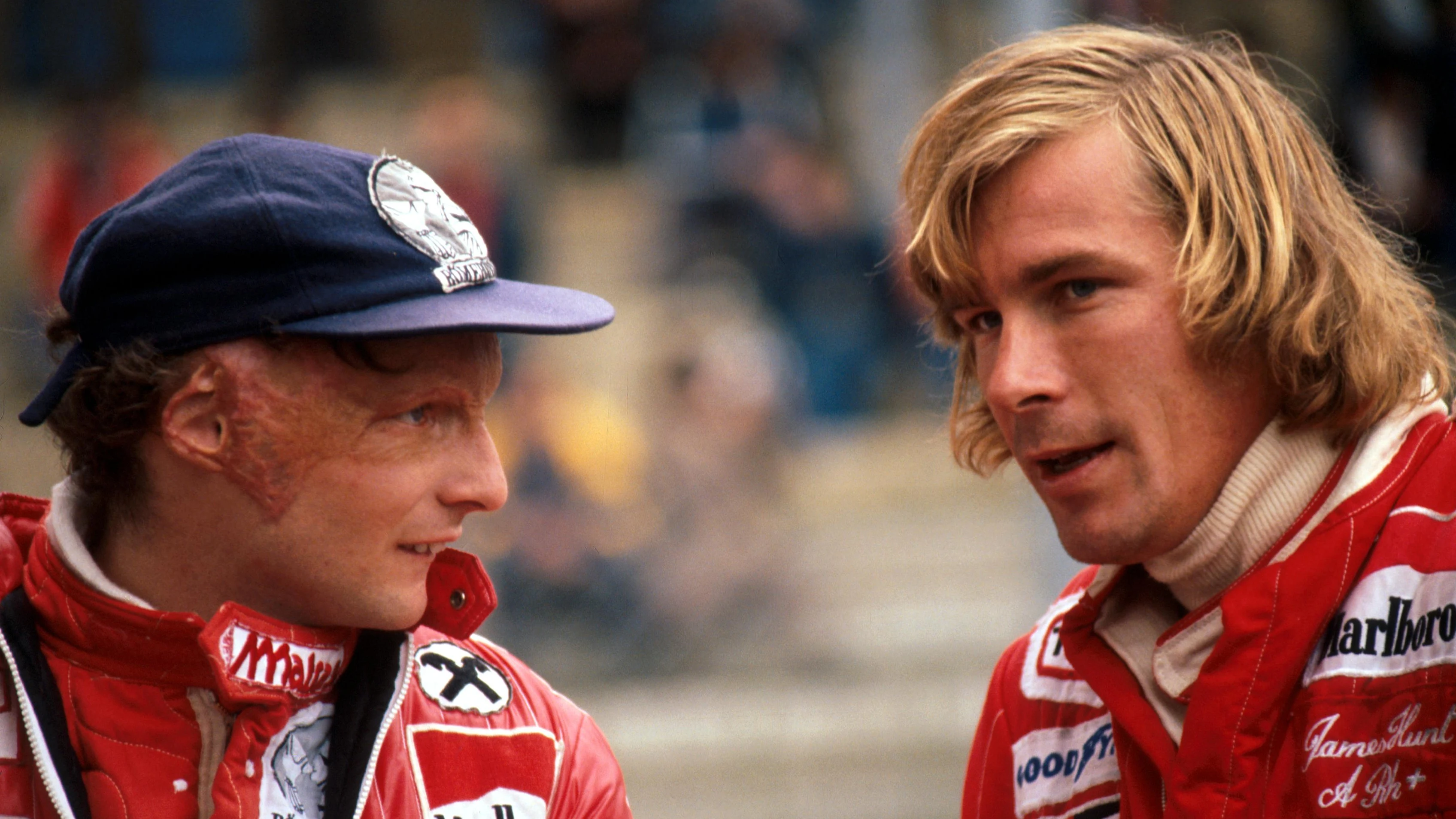 Despite being Ã”bitterÃ• rivals second place finisher Niki Lauda (AUT) Ferrari (left) talks with