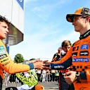 MONZA, ITALY - SEPTEMBER 07: Second placed Lando Norris of Great Britain and McLaren and Third placed Oscar Piastri of Australia and McLaren congralate each other in parc ferme during the F1 Grand Prix of Italy at Autodromo Nazionale Monza on September 07, 2025 in Monza, Italy. (Photo by Mark Sutton - Formula 1/Formula 1 via Getty Images)