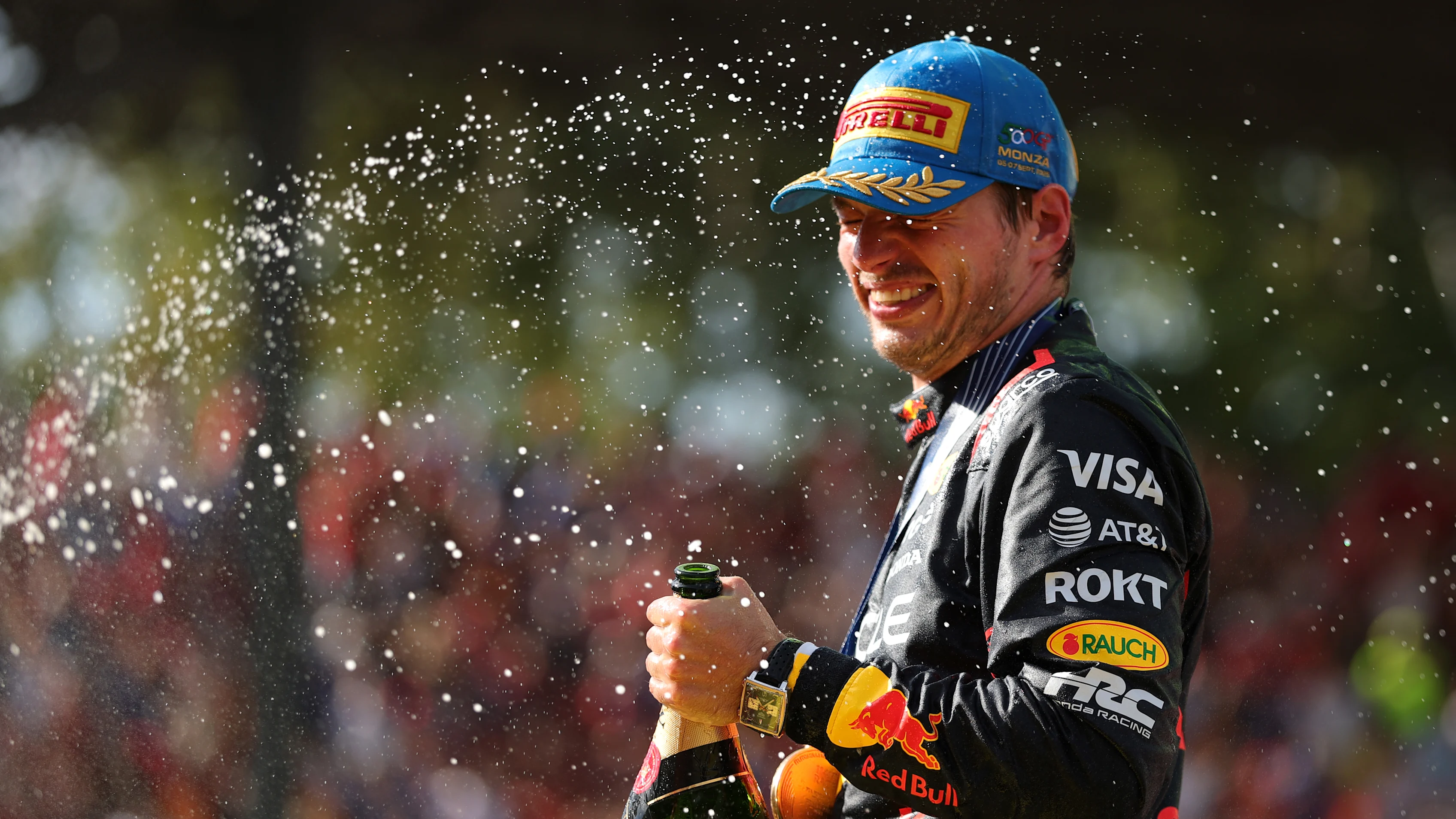 MONZA, ITALY - SEPTEMBER 07: Race winner Max Verstappen of the Netherlands and Oracle Red Bull Racing celebrates with Champagne on the podium during the F1 Grand Prix of Italy at Autodromo Nazionale Monza on September 07, 2025 in Monza, Italy. (Photo by Bryn Lennon - Formula 1/Formula 1 via Getty Images)
