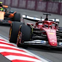 BAKU, AZERBAIJAN - SEPTEMBER 21: Charles Leclerc of Monaco driving the (16) Scuderia Ferrari SF-25 leads Lando Norris of Great Britain driving the (4) McLaren MCL39 Mercedes on track during the F1 Grand Prix of Azerbaijan at Baku City Circuit on September 21, 2025 in Baku, Azerbaijan. (Photo by Clive Rose/Getty Images)
