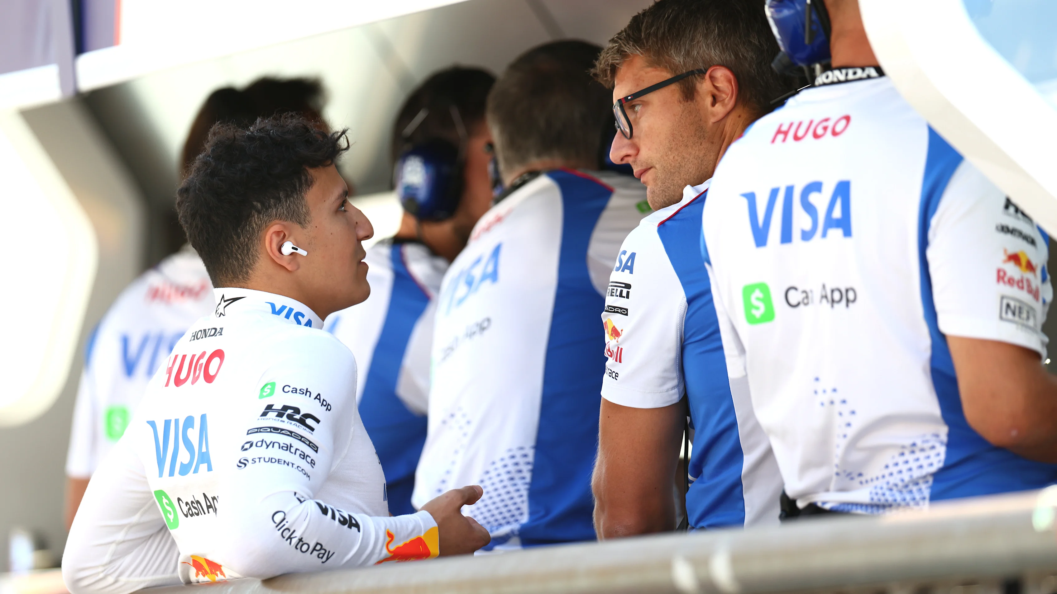 MONZA, ITALY - SEPTEMBER 06: Isack Hadjar of France and Visa Cash App Racing Bulls talks with Pierre Hamelin, Race Engineer of Visa Cash App Racing Bulls on the pit wall during qualifying ahead of the F1 Grand Prix of Italy at Autodromo Nazionale Monza on September 06, 2025 in Monza, Italy. (Photo by Bryn Lennon - Formula 1/Formula 1 via Getty Images)