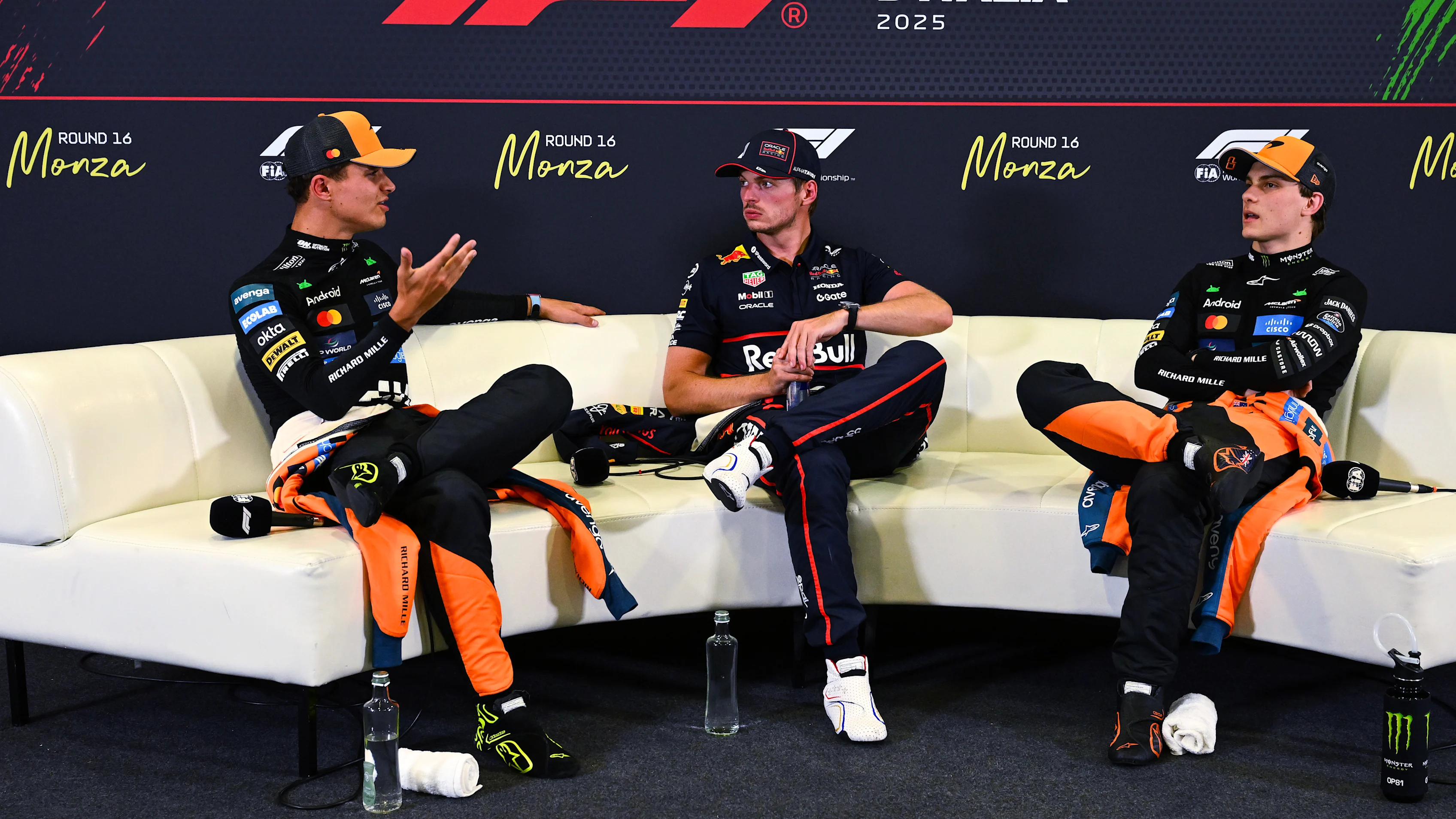 MONZA, ITALY - SEPTEMBER 06: Pole position qualifier Max Verstappen of the Netherlands and Oracle Red Bull Racing Second placed qualifier Lando Norris of Great Britain and McLaren and Third placed qualifier Oscar Piastri of Australia and McLaren talk in the Drivers Press Conference during qualifying ahead of the F1 Grand Prix of Italy at Autodromo Nazionale Monza on September 06, 2025 in Monza, Italy. (Photo by Mark Sutton/Getty Images)