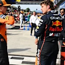 MONZA, ITALY - SEPTEMBER 07: Race winner Max Verstappen of the Netherlands and Oracle Red Bull Racing and Third placed Oscar Piastri of Australia and McLaren talk in parc ferme during the F1 Grand Prix of Italy at Autodromo Nazionale Monza on September 07, 2025 in Monza, Italy. (Photo by Mark Sutton - Formula 1/Formula 1 via Getty Images)