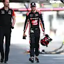 BAKU, AZERBAIJAN - SEPTEMBER 20: Eighteenth placed qualifier Esteban Ocon of France and Haas F1 walks in the Pitlane during qualifying ahead of the F1 Grand Prix of Azerbaijan at Baku City Circuit on September 20, 2025 in Baku, Azerbaijan. (Photo by Bryn Lennon - Formula 1/Formula 1 via Getty Images)