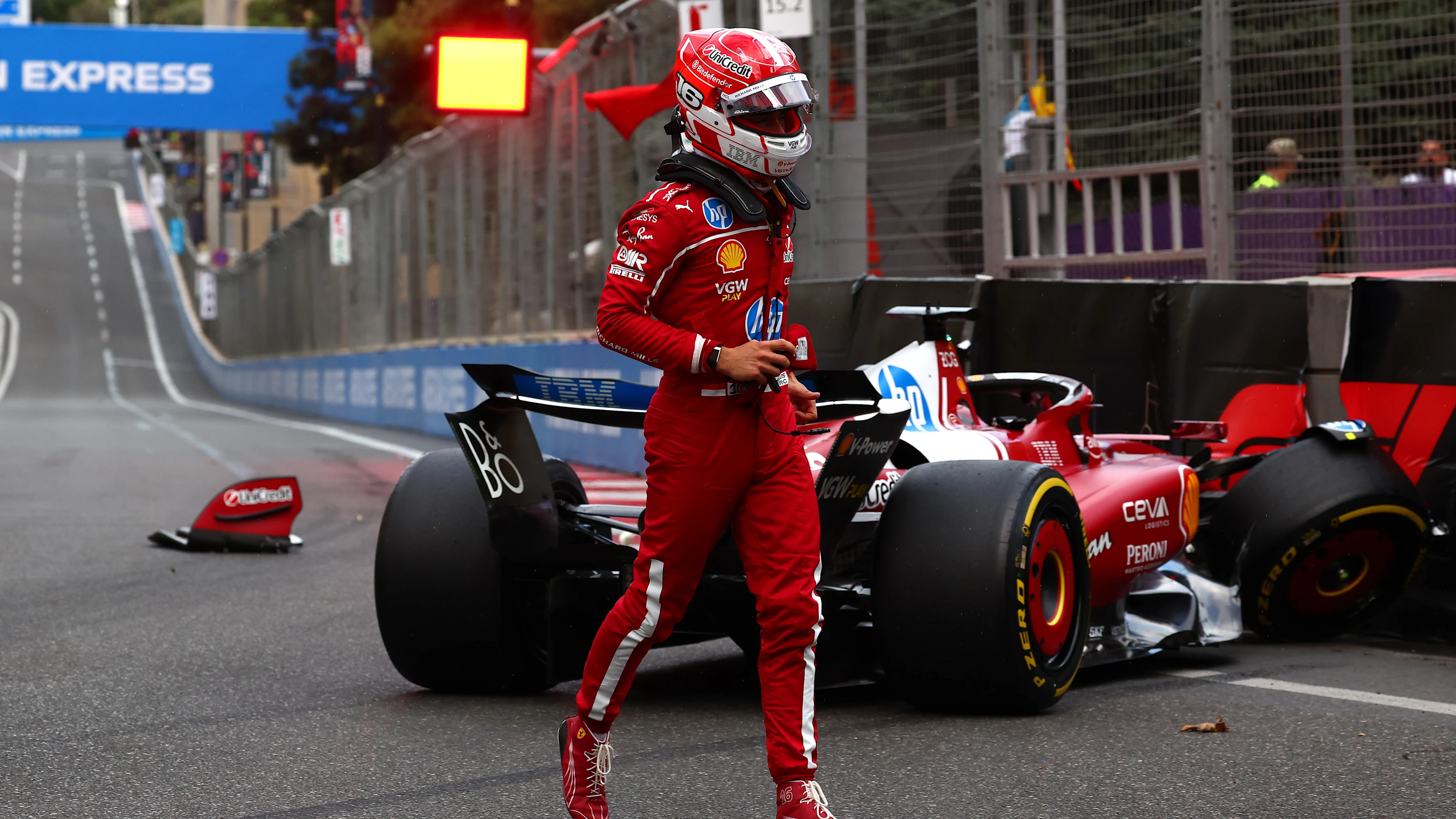 BAKU, AZERBAIJAN - SEPTEMBER 20: Charles Leclerc of Monaco and Scuderia Ferrari walks away from his damaged car after a crash during qualifying ahead of the F1 Grand Prix of Azerbaijan at Baku City Circuit on September 20, 2025 in Baku, Azerbaijan. (Photo by Joe Portlock/Getty Images)
