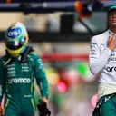 BAKU, AZERBAIJAN - SEPTEMBER 20: Fourteenth placed qualifier Lance Stroll of Canada and Aston Martin F1 Team and Eleventh placed qualifier Fernando Alonso of Spain and Aston Martin F1 Team walk in the Pitlane during qualifying ahead of the F1 Grand Prix of Azerbaijan at Baku City Circuit on September 20, 2025 in Baku, Azerbaijan. (Photo by Bryn Lennon - Formula 1/Formula 1 via Getty Images)