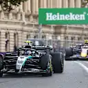 BAKU, AZERBAIJAN - SEPTEMBER 21: Andrea Kimi Antonelli of Italy driving the (12) Mercedes AMG Petronas F1 Team W16 leads Yuki Tsunoda of Japan driving the (22) Oracle Red Bull Racing RB21 on track during the F1 Grand Prix of Azerbaijan at Baku City Circuit on September 21, 2025 in Baku, Azerbaijan. (Photo by Joe Portlock/Getty Images)