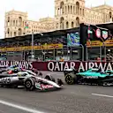 BAKU, AZERBAIJAN - SEPTEMBER 21: Lance Stroll of Canada driving the (18) Aston Martin F1 Team AMR25 Mercedes and Oliver Bearman of Great Britain driving the (87) Haas F1 VF-25 Ferrari battle for track position during the F1 Grand Prix of Azerbaijan at Baku City Circuit on September 21, 2025 in Baku, Azerbaijan. (Photo by Clive Rose/Getty Images)