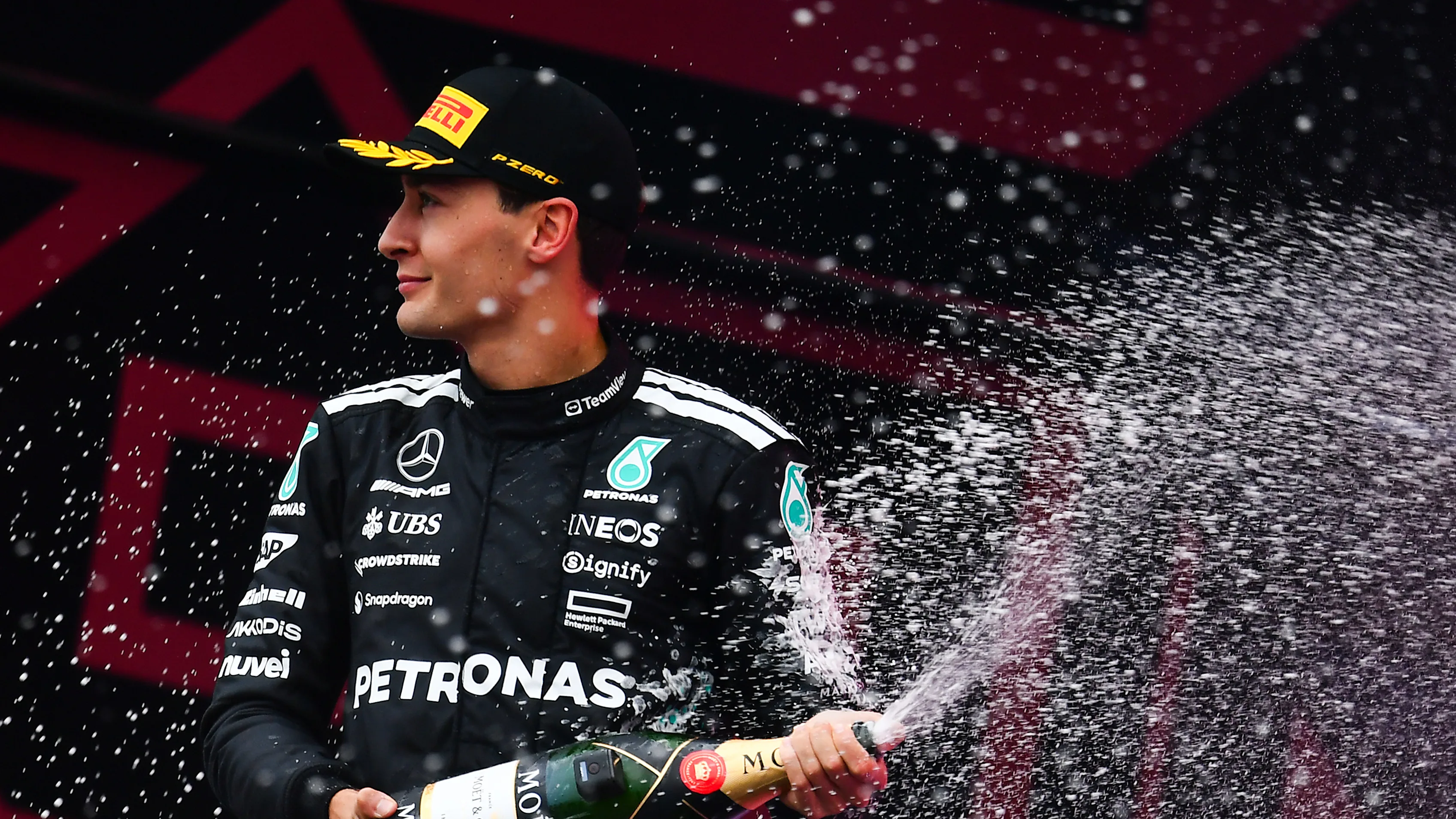 BAKU, AZERBAIJAN - SEPTEMBER 21: Second placed George Russell of Great Britain and Mercedes AMG Petronas F1 Team sprays Champagne on the podium during the F1 Grand Prix of Azerbaijan at Baku City Circuit on September 21, 2025 in Baku, Azerbaijan. (Photo by James Sutton - Formula 1/Formula 1 via Getty Images)