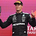 BAKU, AZERBAIJAN - SEPTEMBER 21: Second placed George Russell of Great Britain and Mercedes AMG Petronas F1 Team on the podium during the F1 Grand Prix of Azerbaijan at Baku City Circuit on September 21, 2025 in Baku, Azerbaijan. (Photo by Mark Sutton - Formula 1/Formula 1 via Getty Images)