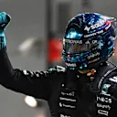SINGAPORE, SINGAPORE - OCTOBER 04: Pole position qualifier George Russell of Great Britain and Mercedes AMG Petronas F1 Team celebrates on arrival in parc ferme during qualifying ahead of the F1 Grand Prix of Singapore at Marina Bay Street Circuit on October 04, 2025 in Singapore, Singapore. (Photo by Rudy Carezzevoli/Getty Images)