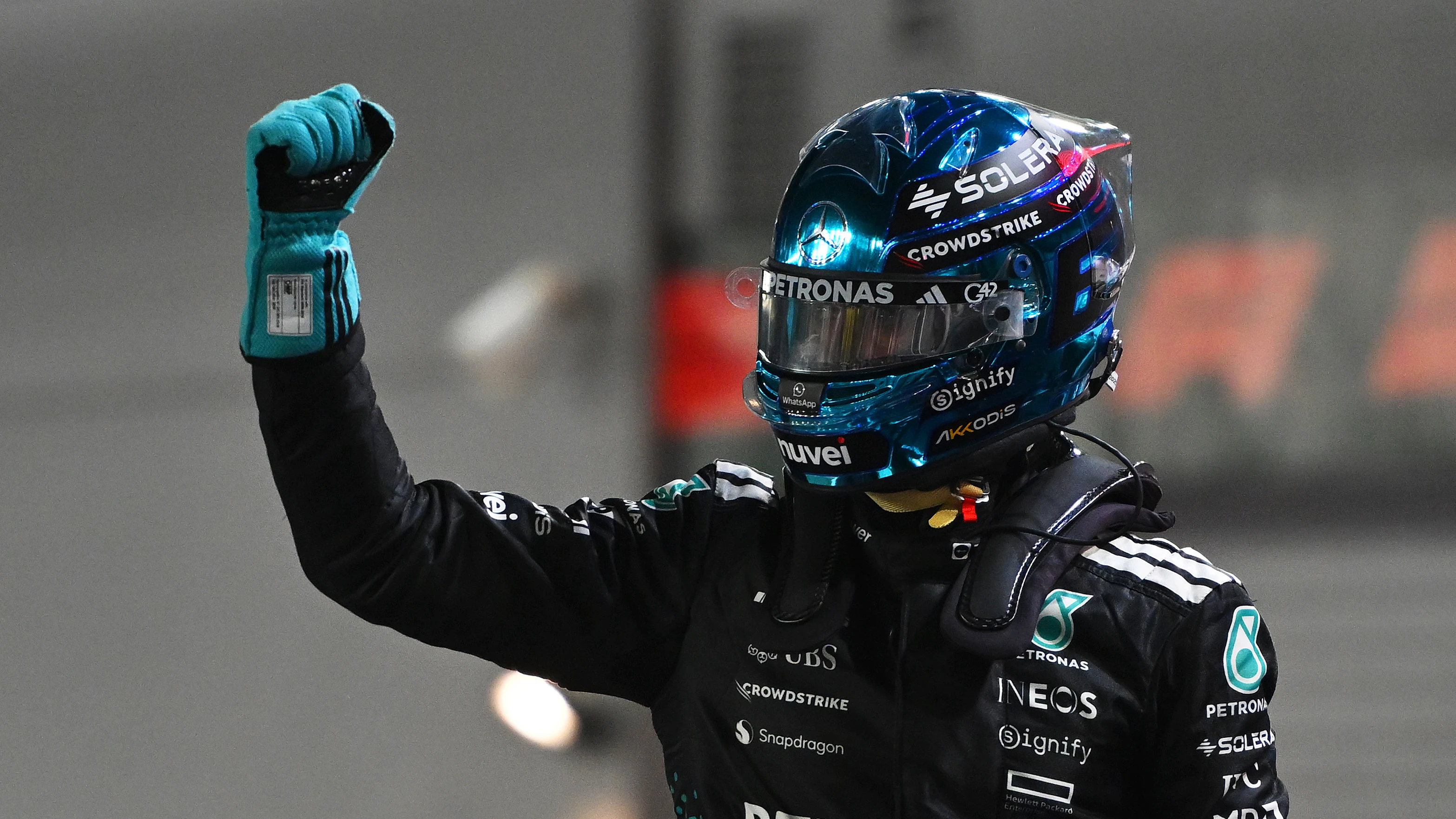 SINGAPORE, SINGAPORE - OCTOBER 04: Pole position qualifier George Russell of Great Britain and Mercedes AMG Petronas F1 Team celebrates on arrival in parc ferme during qualifying ahead of the F1 Grand Prix of Singapore at Marina Bay Street Circuit on October 04, 2025 in Singapore, Singapore. (Photo by Rudy Carezzevoli/Getty Images)