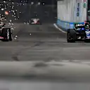 SINGAPORE, SINGAPORE - OCTOBER 05: Sparks fly behind Oliver Bearman of Great Britain driving the (87) Haas F1 VF-25 Ferrari and Alexander Albon of Thailand driving the (23) Williams FW47 Mercedes as they battle for track position during the F1 Grand Prix of Singapore at Marina Bay Street Circuit on October 05, 2025 in Singapore, Singapore. (Photo by Rudy Carezzevoli/Getty Images)