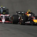 AUSTIN, TEXAS - OCTOBER 18: Yuki Tsunoda of Japan driving the (22) Oracle Red Bull Racing RB21 leads Oliver Bearman of Great Britain driving the (87) Haas F1 VF-25 Ferrari on track during the Sprint ahead of the F1 Grand Prix of United States at Circuit of The Americas on October 18, 2025 in Austin, Texas. (Photo by Clive Mason/Getty Images)