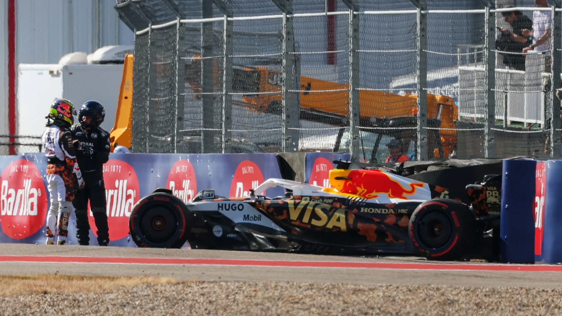 AUSTIN, TEXAS - OCTOBER 18: Isack Hadjar of France and Visa Cash App Racing Bulls stands beside his damaged car after a crash prior to Qualifying ahead of the F1 Grand Prix of United States at Circuit of The Americas on October 18, 2025 in Austin, Texas. (Photo by Clive Rose/Getty Images)