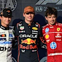 AUSTIN, TEXAS - OCTOBER 18: Pole position qualifier Max Verstappen of the Netherlands and Oracle Red Bull Racing Second placed qualifier Lando Norris of Great Britain and McLaren and Third placed qualifier Charles Leclerc of Monaco and Scuderia Ferrari look on during Qualifying ahead of the F1 Grand Prix of United States at Circuit of The Americas on October 18, 2025 in Austin, Texas. (Photo by Rudy Carezzevoli/Getty Images)
