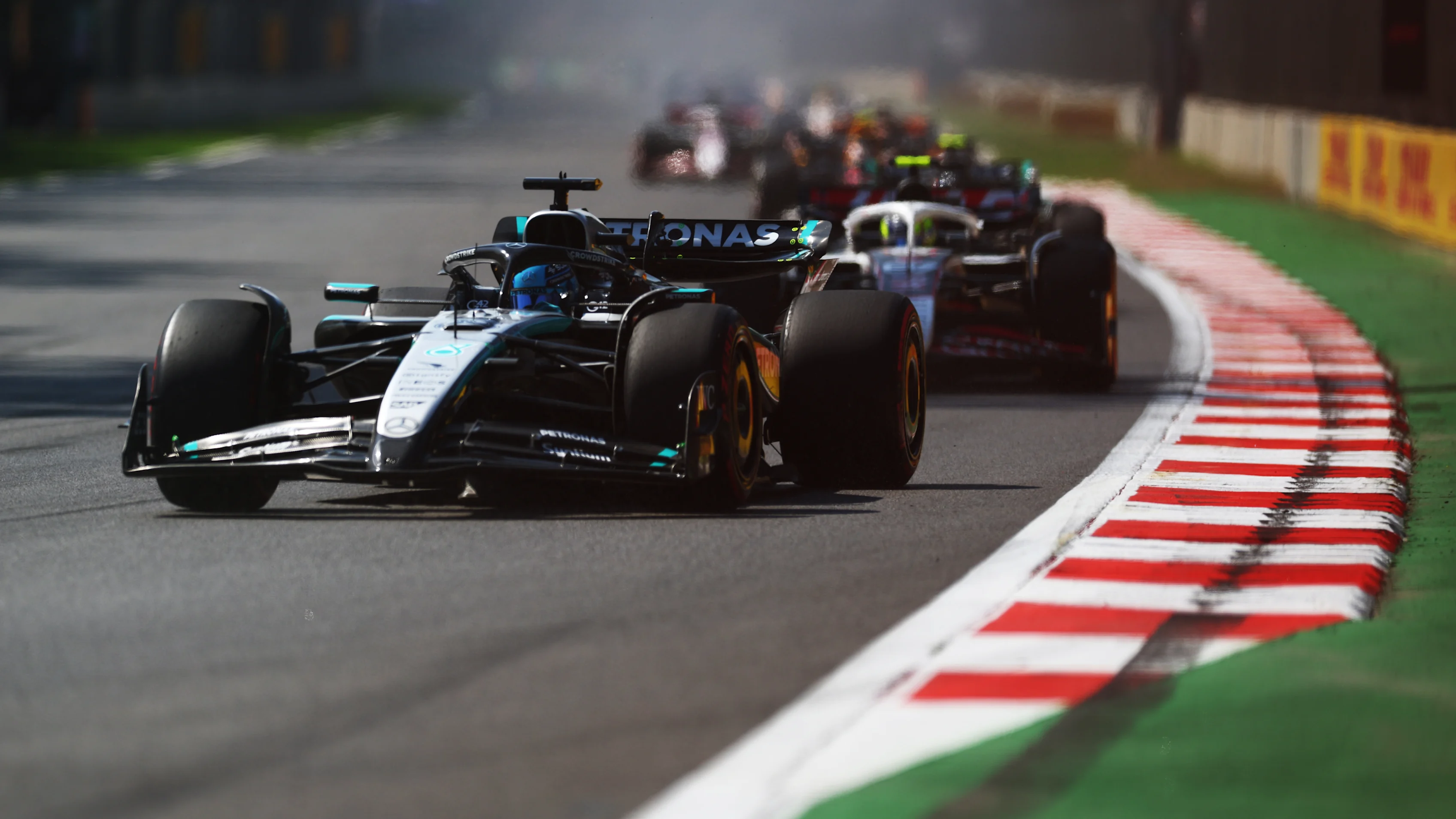 MEXICO CITY, MEXICO - OCTOBER 26: George Russell of Great Britain driving the (63) Mercedes AMG Petronas F1 Team W16 leads Oliver Bearman of Great Britain driving the (87) Haas F1 VF-25 Ferrari on track during the F1 Grand Prix of Mexico at Autodromo Hermanos Rodriguez on October 26, 2025 in Mexico City, Mexico. (Photo by Clive Rose/Getty Images)