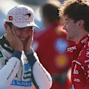 MEXICO CITY, MEXICO - OCTOBER 26: Race winner Lando Norris of Great Britain and McLaren and Second placed Charles Leclerc of Monaco and Scuderia Ferrari talk in parc ferme during the F1 Grand Prix of Mexico at Autodromo Hermanos Rodriguez on October 26, 2025 in Mexico City, Mexico. (Photo by Clive Rose/Getty Images)