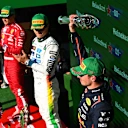 MEXICO CITY, MEXICO - OCTOBER 26: Third placed Max Verstappen of the Netherlands and Oracle Red Bull Racing lifts his trophy on the podium during the F1 Grand Prix of Mexico at Autodromo Hermanos Rodriguez on October 26, 2025 in Mexico City, Mexico. (Photo by Mark Sutton - Formula 1/Formula 1 via Getty Images)