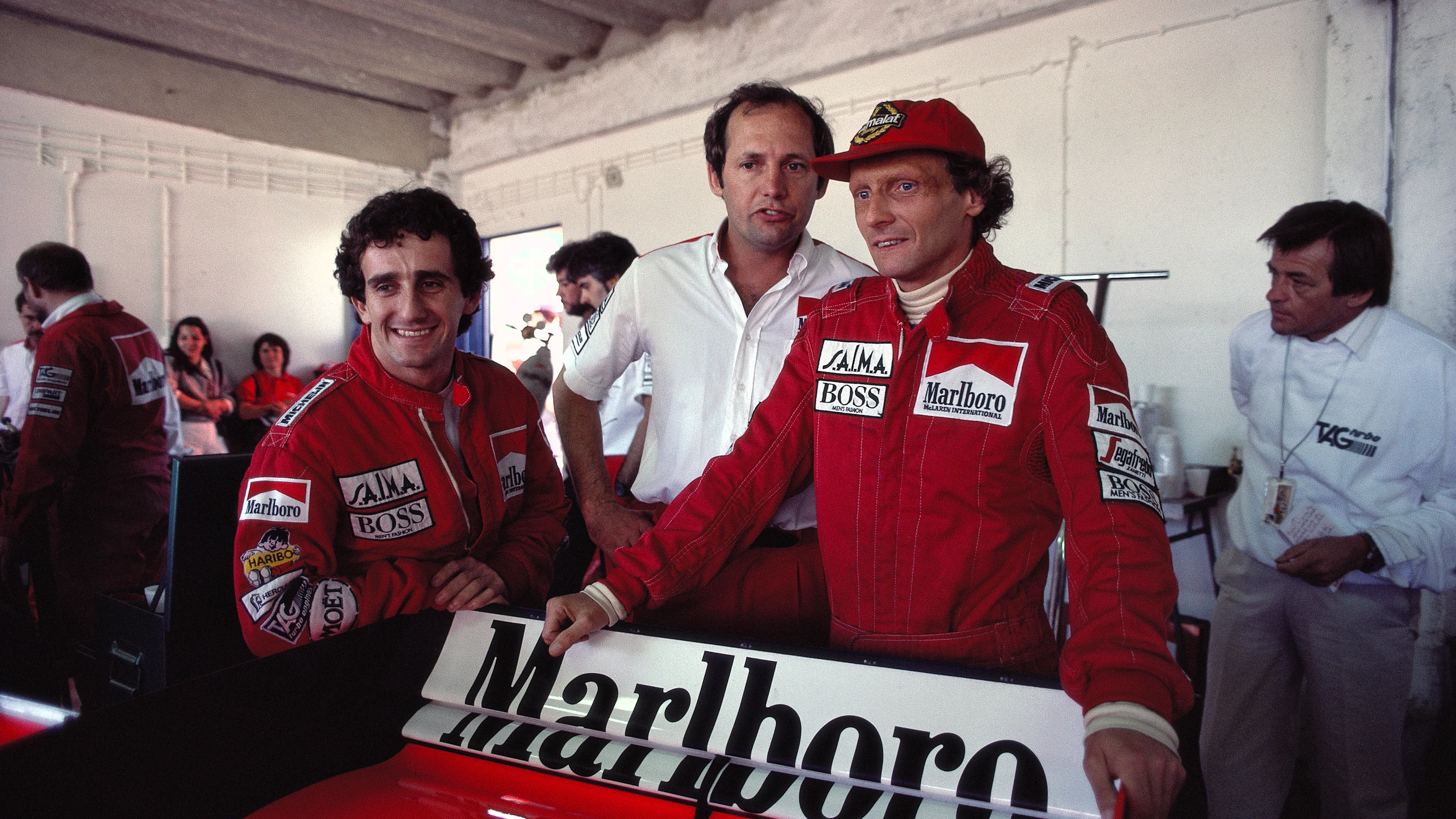 CIRCUITO ESTORIL, PORTUGAL - OCTOBER 21: Alain Prost, Ron Dennis and Niki Lauda in the McLaren