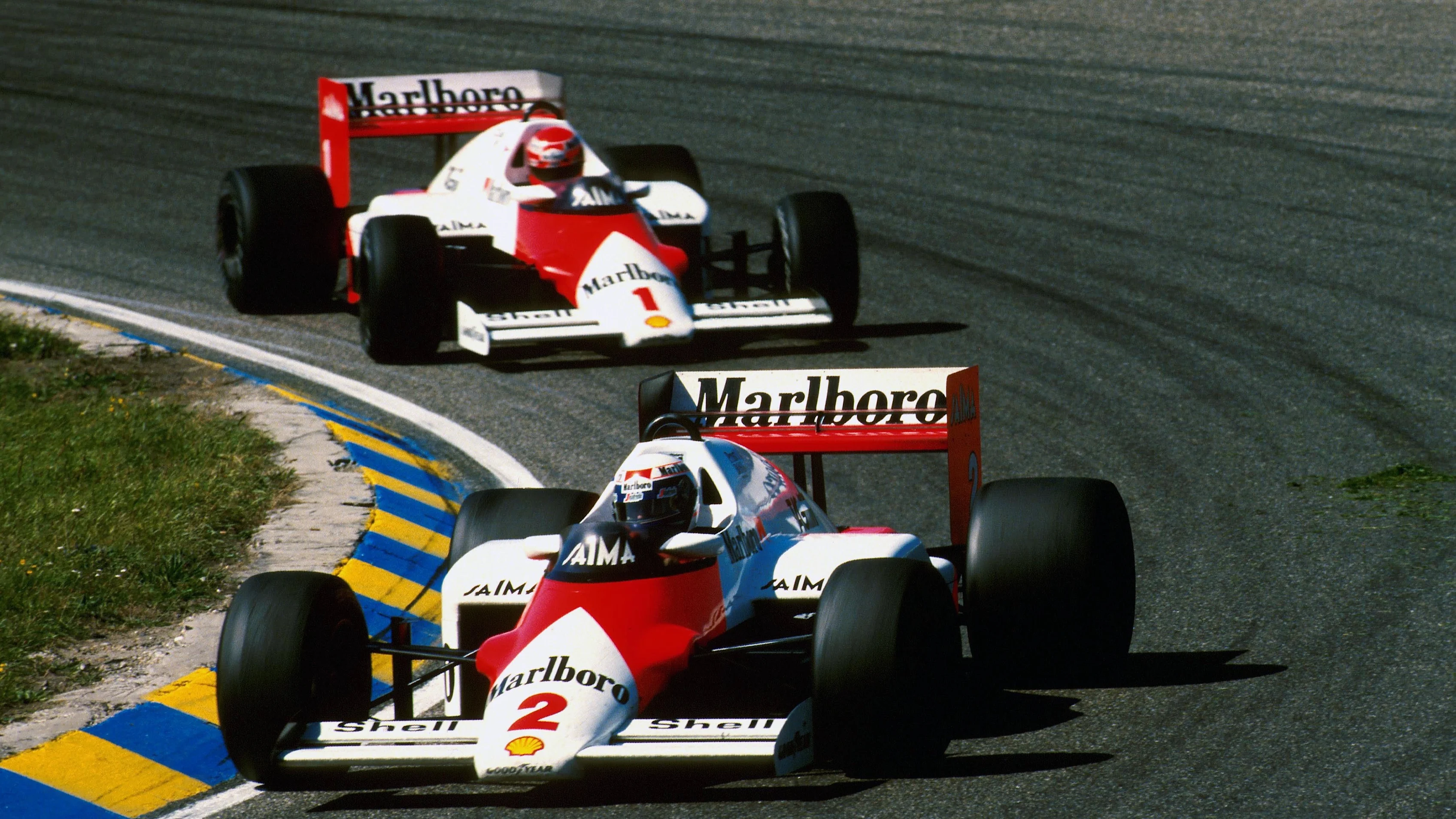 Alain Prost (FRA) McLaren MP4/2B leads teammate Niki Lauda (AUS) who won the race Formula One World