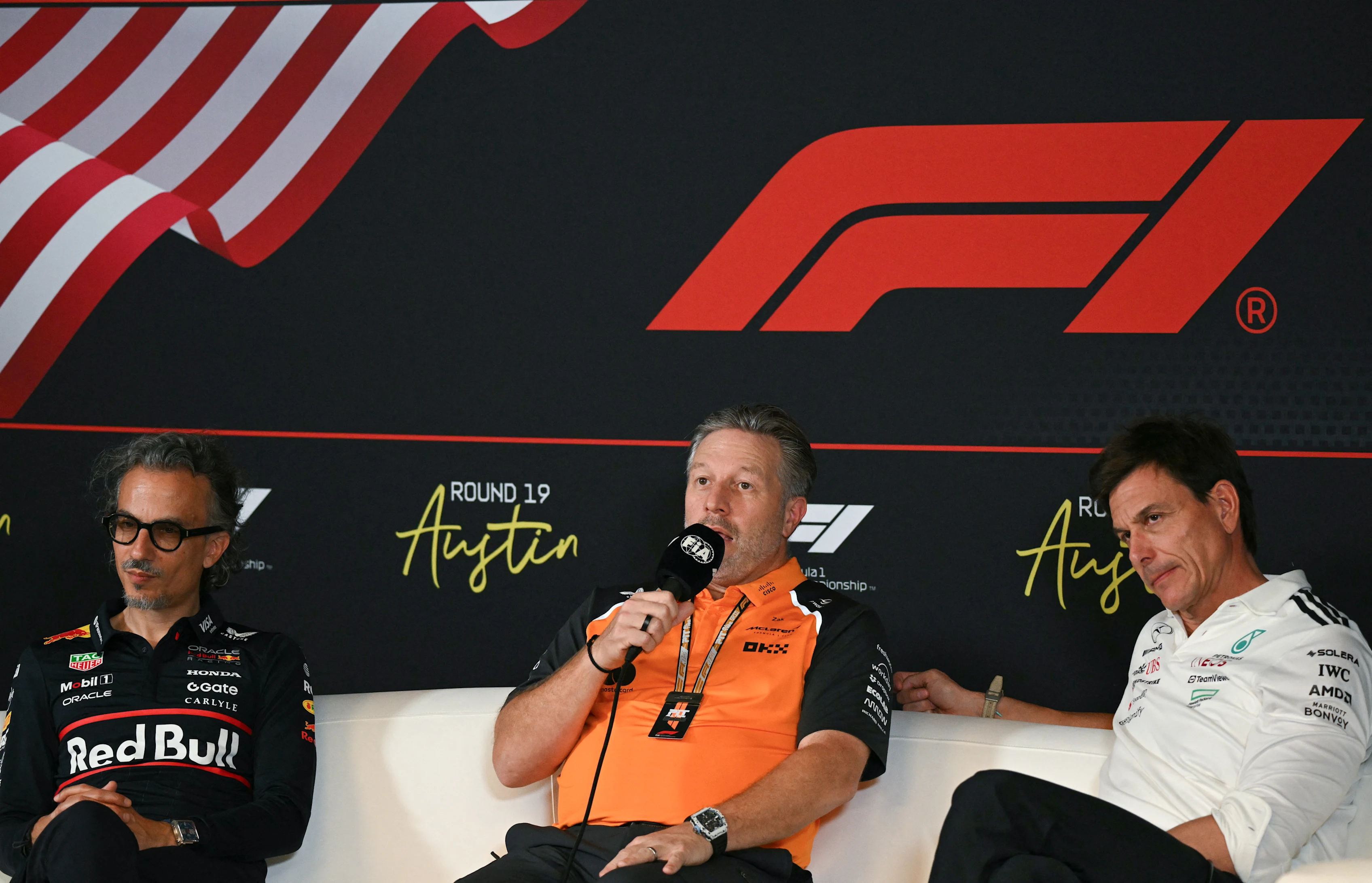 (L/R) Red Bull Racing's team principal Laurent Mekies, McLaren's CEO Zak Brown, and Mercedes'